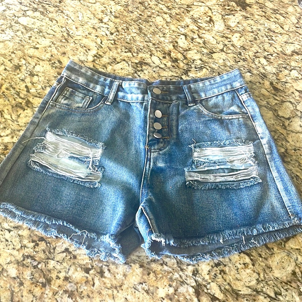 Medium blue ripped jean shorts